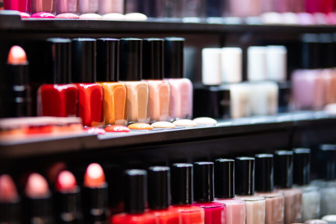 Set of nail polish on shelves in cosmetics beauty store